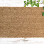 Coir doormat mock up. Floral template mockup on wooden background