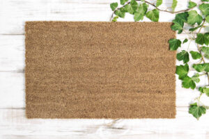 Coir doormat mock up. Floral template mockup on wooden background